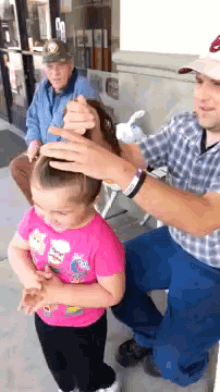 Dad Makes The Perfect Bun GIF - Dad Kid Hair GIFs