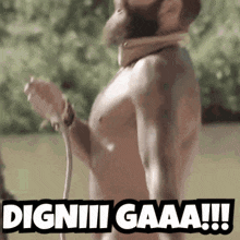 a shirtless man with a rope around his neck says dignii gaaa