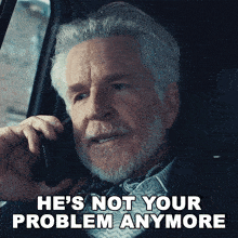 a man talking on a cell phone with the words he 's not your problem anymore