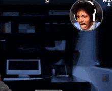 a woman wearing headphones looks at a mario character