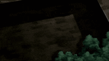 a dark room with a blue light coming out of the corner .