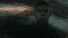 a blurry picture of a person swimming in a dark room