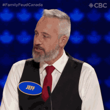 a man with the name jeff on his vest
