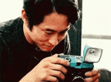 Steven Yeun Camera GIF - Steven Yeun Camera Photograph GIFs