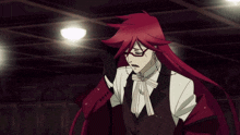 a man with red hair is wearing glasses and a suit