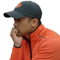 a man wearing a black hat that says kinesis