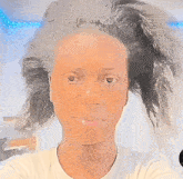 a woman in a white shirt has a nose ring