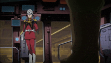 a man in a red suit and a white helmet stands in a room
