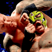 Randy Orton Rips Mask GIF - Randy Orton Rips Mask Rey Mysterio GIFs