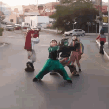 a group of children are playing on a street in front of a building that has the word exit on it