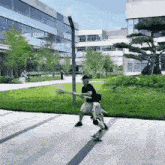 a man is riding a skateboard on a sidewalk in front of a building