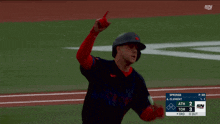 a baseball player is running on the field with a scoreboard behind him that says sn