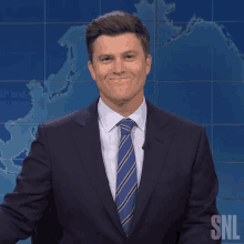 trying not to laugh colin jost saturday night live amused smiling