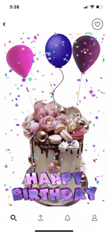 a phone screen shows a birthday cake with balloons and confetti