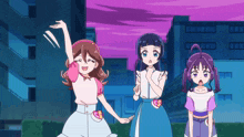 three anime girls are standing next to each other in front of a city