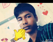 a young man is taking a selfie with a thumbs up emoji