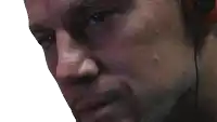 a close up of a man 's face with ear buds