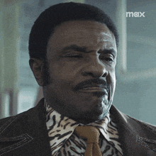 a close up of a man 's face with the word max in the corner