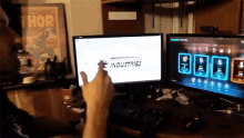 a person is playing a video game on a dell monitor
