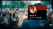 a man in a superman costume stands in front of a sign that says yusuf yooooosuf
