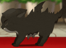 a black cat with a bat wing on its tail