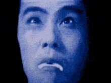 a close up of a person 's face with a sad look on his face