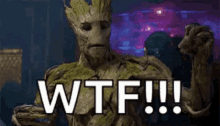 groot from guardians of the galaxy is holding his fist up and saying wtf !!!