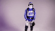 a person wearing a blue and white ultra sweatshirt