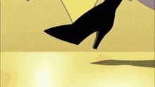 a person wearing a pair of black high heels is standing on a yellow floor