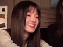a close up of a girl 's face with the name njzfaerie written on the bottom