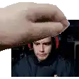 a pixel art of a hand holding a man 's face .