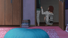 a girl in a white shirt with the word free on the back squats in a room