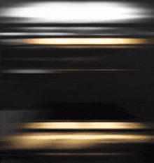 a dark background with a few lines of light coming out of it