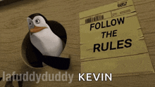 a penguin standing next to a piece of paper that says " follow the rules "
