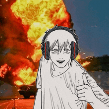 a person wearing headphones is giving a thumbs up in front of an explosion