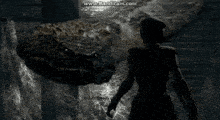a man is standing in front of a giant snake ..