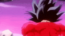 a close up of a person 's back with a red shirt on .