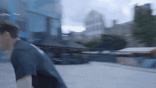 a blurry picture of a man walking in a city