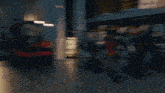 a group of women are dancing in front of a wall that says dirty work