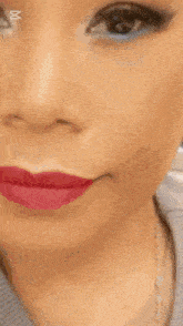 a close up of a woman 's face with marina mall written on the bottom