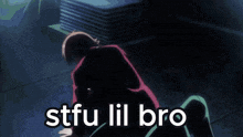 a man in a pink suit is sitting on a chair with the words `` stfu lil bro '' written on it .