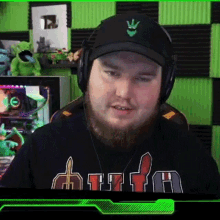 a man with a beard wearing headphones and a hat with a crown on it .