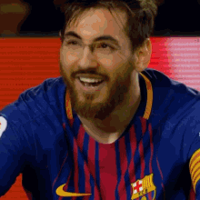 a man with a beard and glasses is wearing a nike shirt