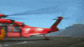 a red helicopter with the word rescue on it