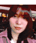 a close up of a woman 's face with a mcdonald 's menu in the background