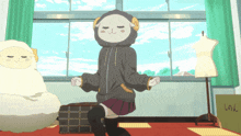 a girl wearing a sheep hoodie is dancing in a room