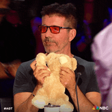Playing With A Teddy Bear Simon Cowell GIF - Playing With A Teddy Bear Simon Cowell America'S Got Talent GIFs