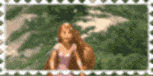 a picture of rapunzel from tangled is blurred in a frame .