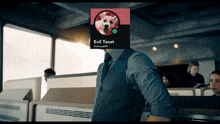 a man in a suit has a picture of a dog on his face and the name evil tanat