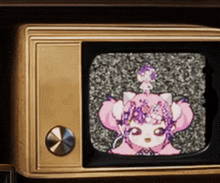 a tv screen shows a cartoon character with a flower on her head